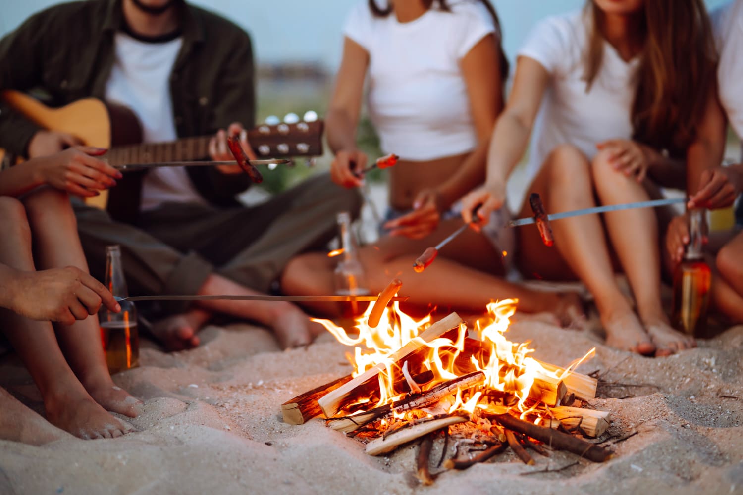 Fall Events - People around the fire in the sand