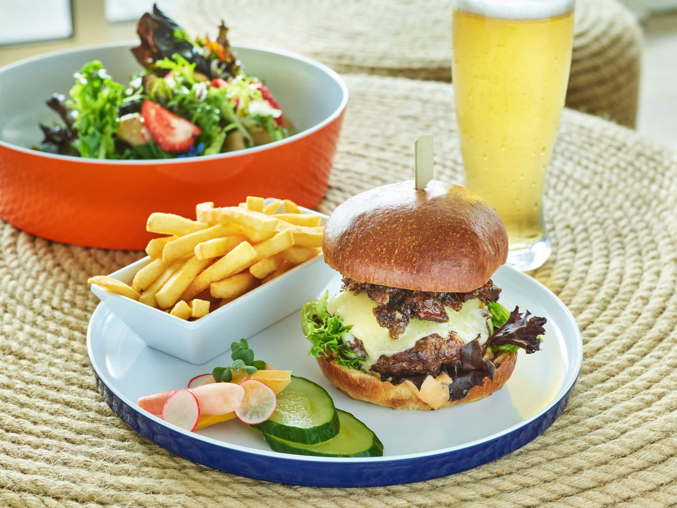 Burguer with fries salad and beer