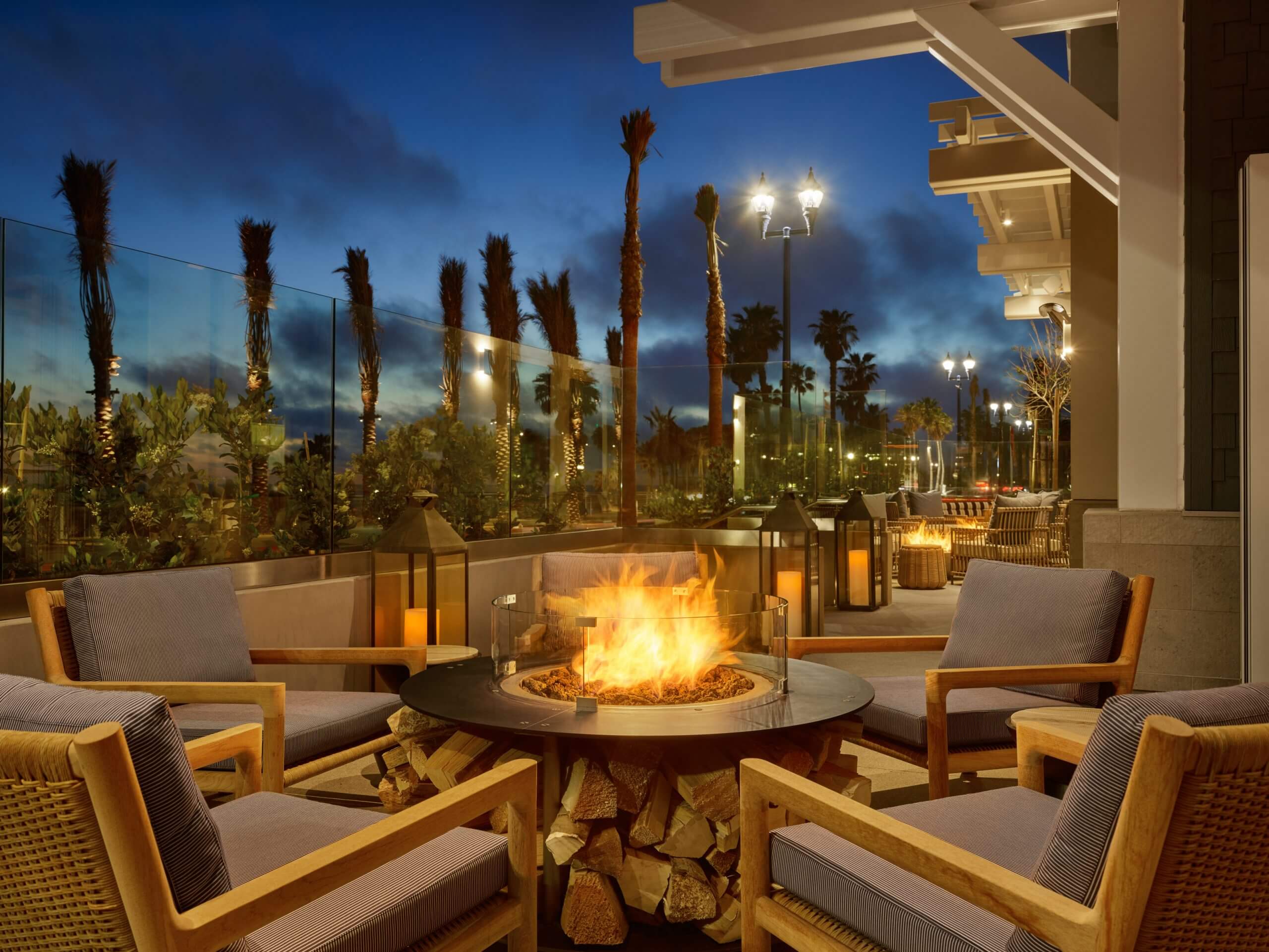 Fireplace at the Oceanside and gray chairs