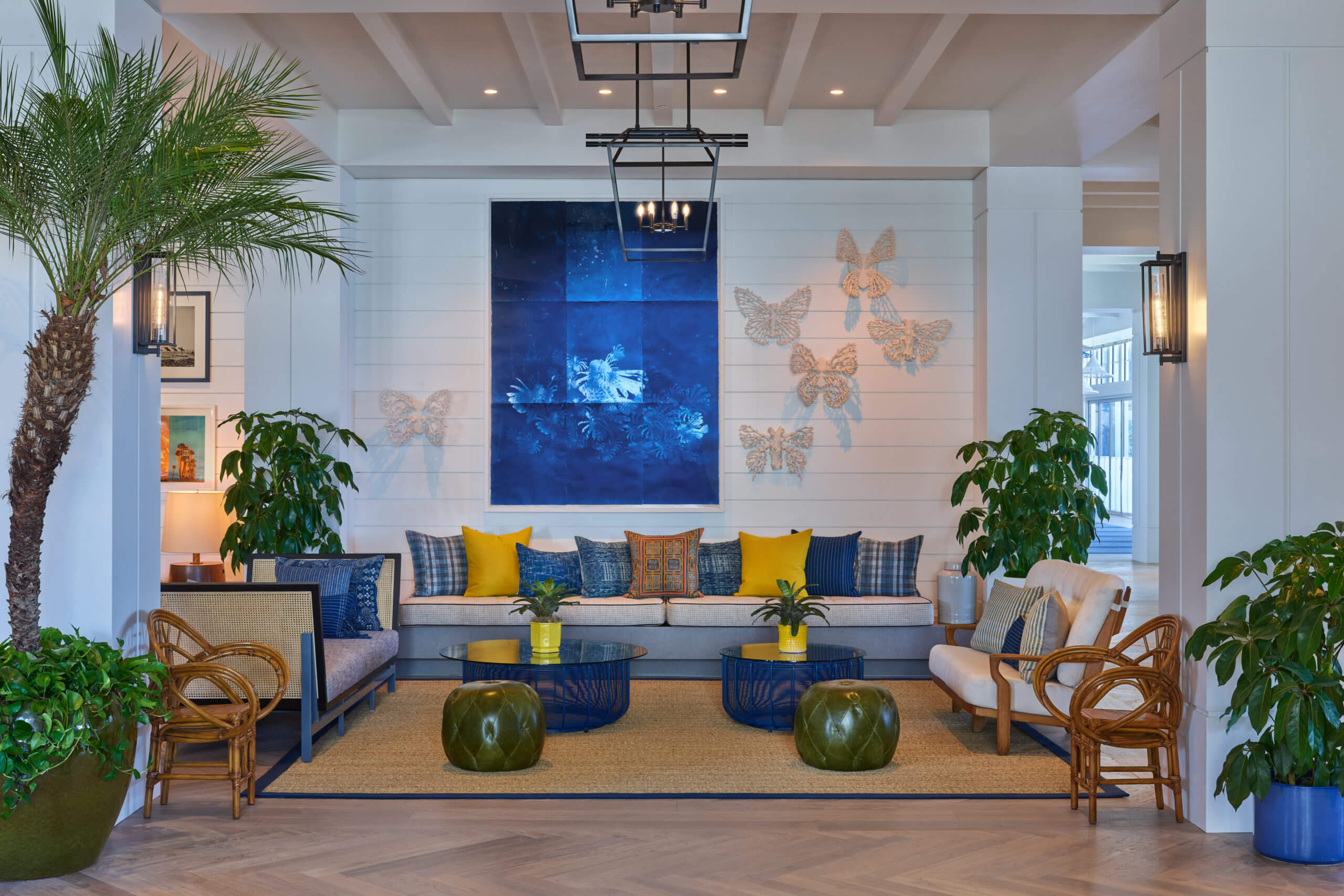 The Lobby with yellow and blue cushions. Blue paintings and butterflies