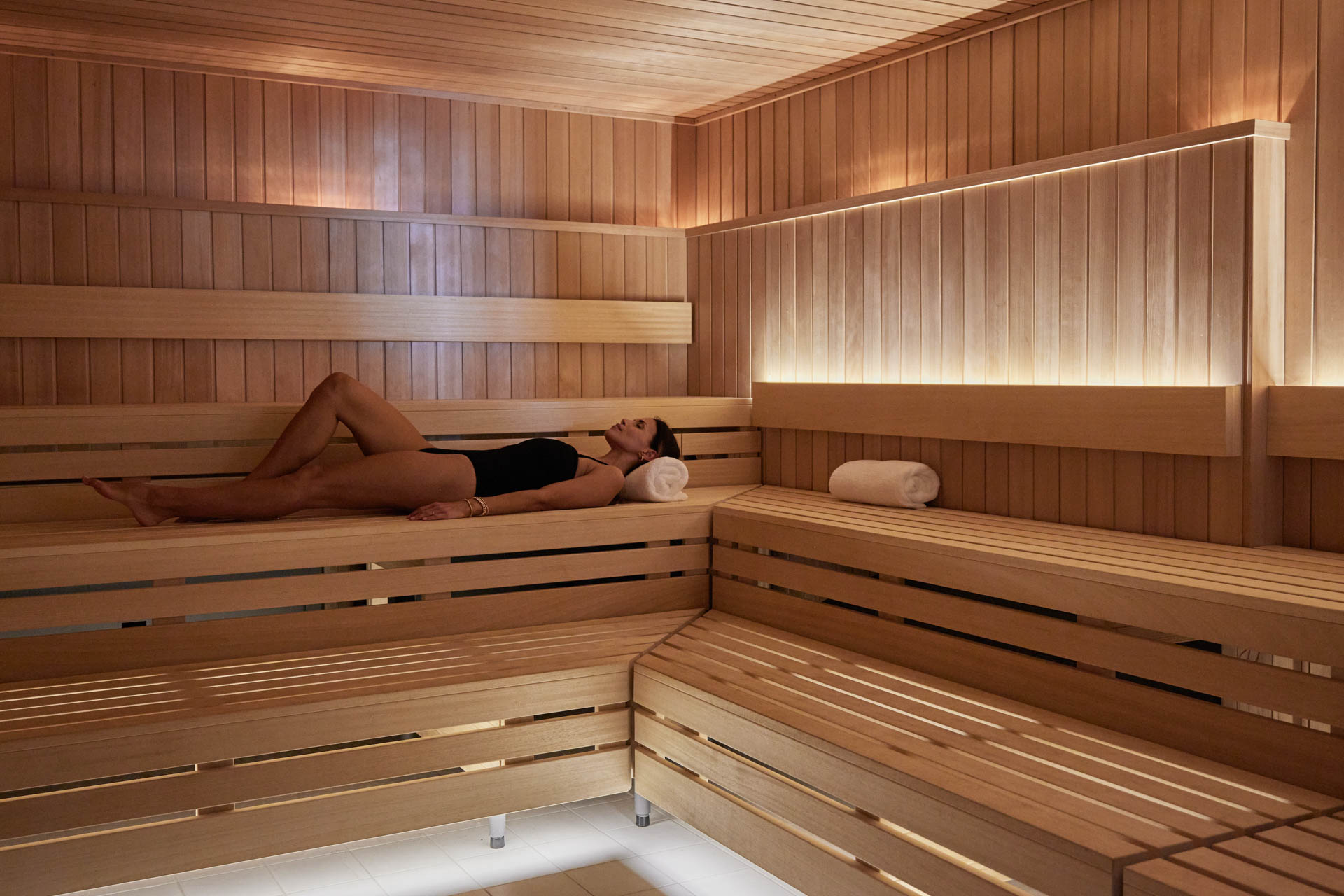 A girl relaxing in a sauna during a spa day in Oceanside