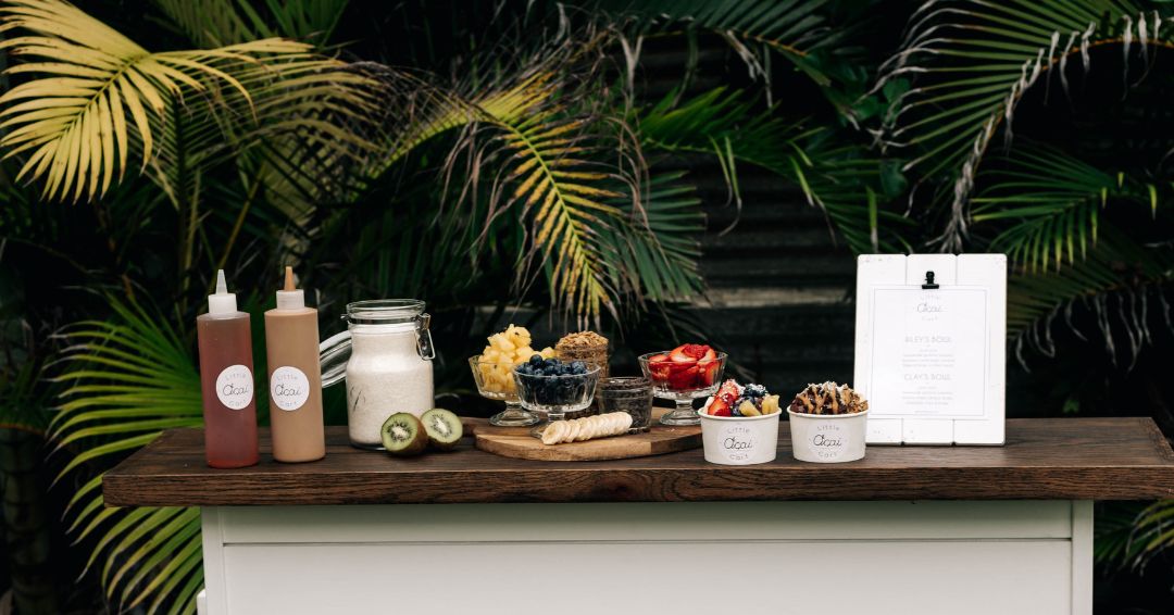 Cart with fruit and acai bowls on the top