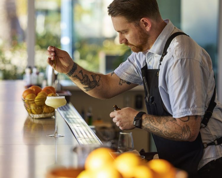 bartender (Kyle) making drink